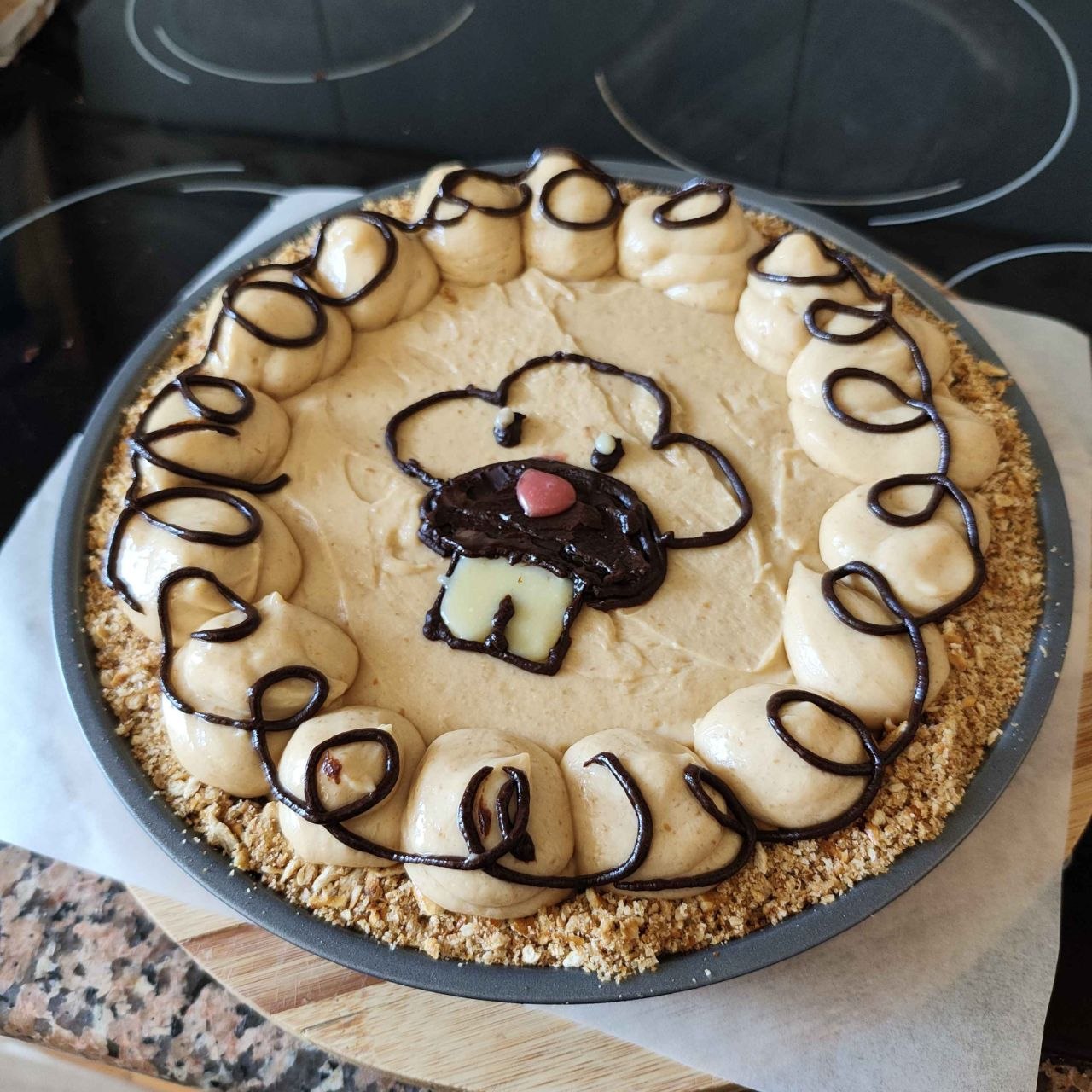 Photo of the bidoof cheesecake next to the image in the recipe book for comparison